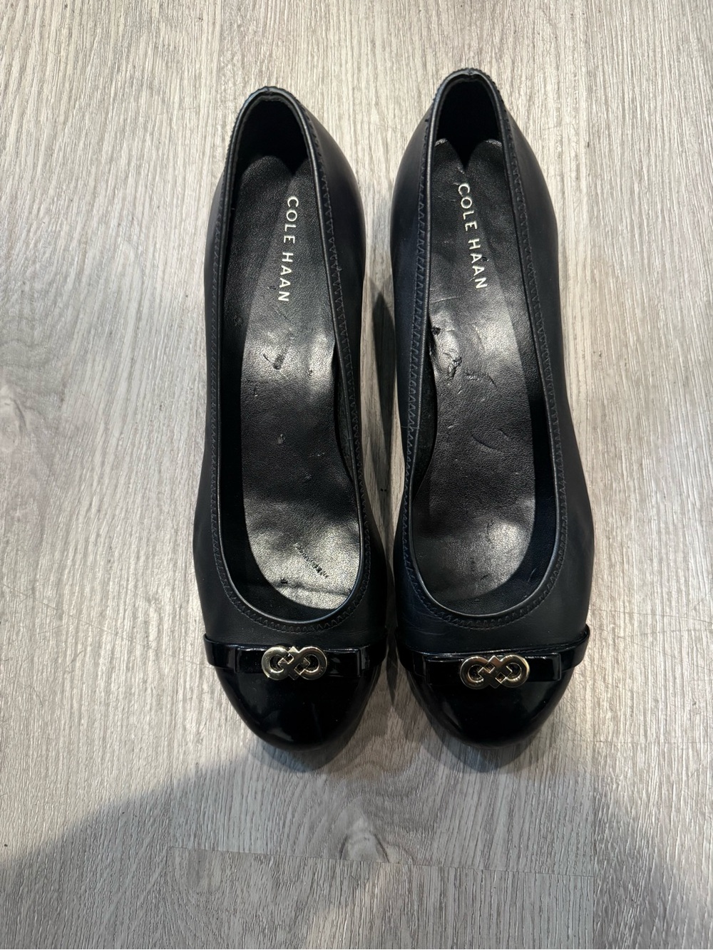 Cole Haan Black Leather Round-Toe Ballet Wedge Heels with Gold Logo Accent